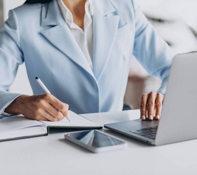 Business woman working in office on computer
